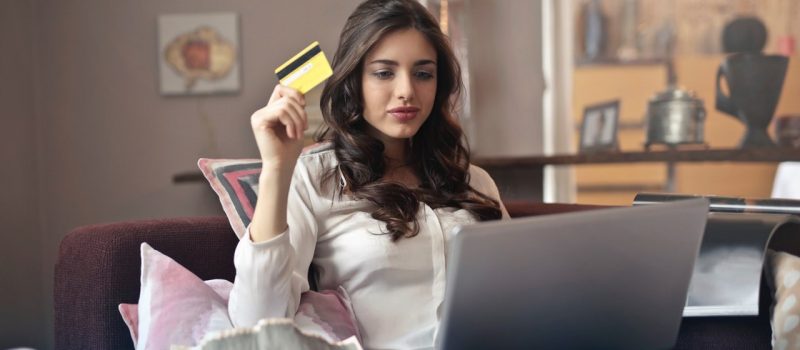 Female with credit card ready to order online